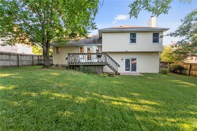 Nicely fenced in backyard with walkout lower patio and upper deck.