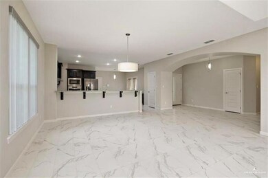Unfurnished room with light tile floors