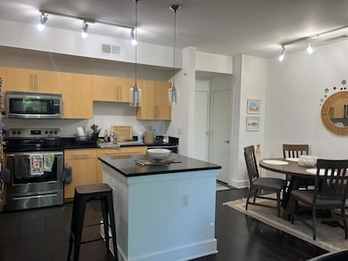 Kitchen featuring dark hardwood / wood-style floor