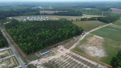 Aerial view of property and surrounding area with rural landscape