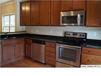 Kitchen with granite countertops and stainless app