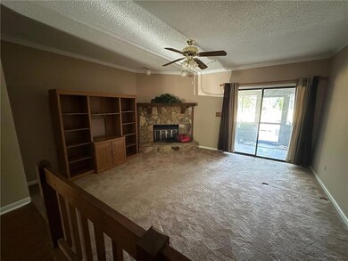 Unfurnished living room with baseboards, crown mol