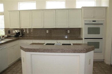 Great kitchen with island and double ovens. Unseen