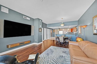Living room with hardwood / wood-style flooring, b