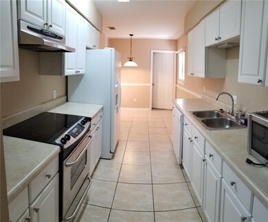 KITCHEN LOOKING AT KITCHEN EATING SPACE (AND DOOR 