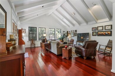 The SPACIOUS living room with vaulted ceilings is