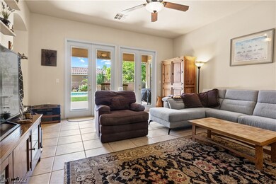 Ceiling fan with light in formal living room.