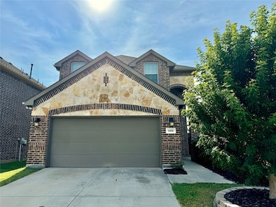 This 2-story home has a great open layout with a cast stone fireplace.