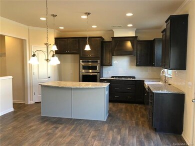 Gourmet kitchen with wall oven and pocket office t