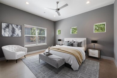 Bedroom featuring ceiling fan, baseboards, and re