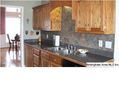 Large Great Room with hardwoods, crown molding, ga