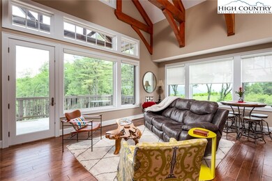 Open Living Area with Vaulted Ceilings and Timber
