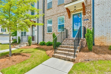 View of exterior entry featuring brick siding