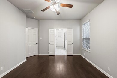 Unfurnished bedroom with dark wood-type flooring,