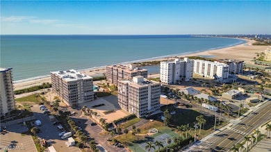 Birds eye view of property with a view of the beac