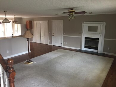 Kitchen over the left and the fireplace in the living room 