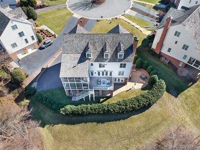 Aerial view of the property and tiered backyard.