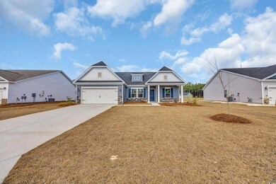 View of front of house with covered porch, concret