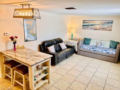 Living area featuring light tile patterned floors