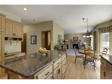 The kitchen is open to the family room to keep you