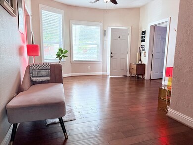 Bright and welcoming entry filled with natural light from three large windows — the perfect first impression.