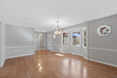 Dining Room with bay window and beautiful wood flo