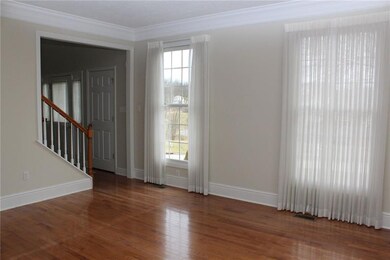 Living room and the hardwood flooring continues