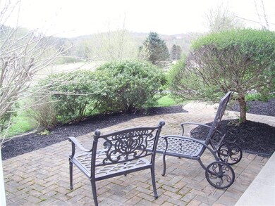 Charming patio in front of home is a great place f
