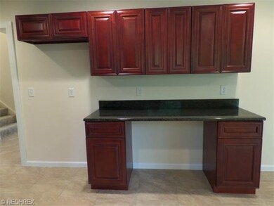Additional cabinets and work space on the opposite