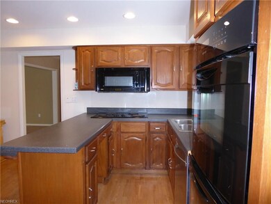 Kitchen features a laminate floor, a nice-sized pa