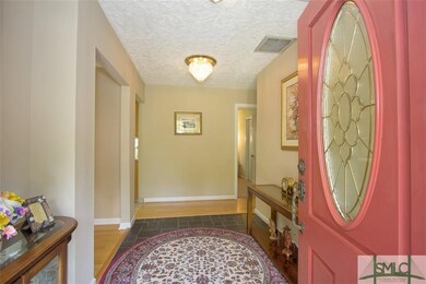 Covered entry leads to lovely foyer!