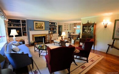 Living room w/ fireplace & built-ins