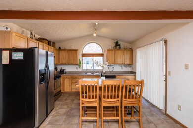 Large island kitchen. Tile floor.