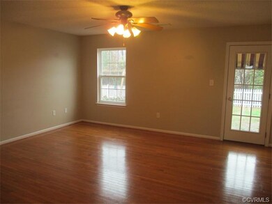 Family Room with rear door to back yard and the Garage.