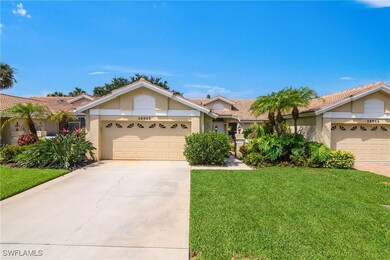 View of front of property featuring a garage, driv