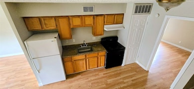 Full view of the kitchen from spiral stairs