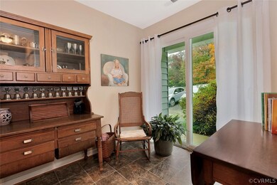 Eat in area of kitchen has sliding glass door to f