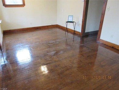 Hardwood floor in living room, hall and second bed