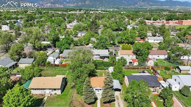 Aerial view of the front of the home and neighborhood.