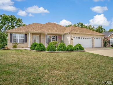 Ranch-style home featuring driveway, a shingled roof, an attached garage, a front yard, and brick siding
