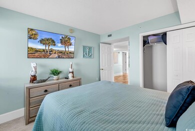 Carpeted bedroom with a closet