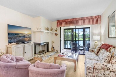 living room with wood burning fireplace