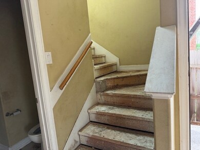Stairway leading to an upper floor which offers 3