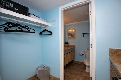 Bathroom with tile patterned flooring, vanity, a t