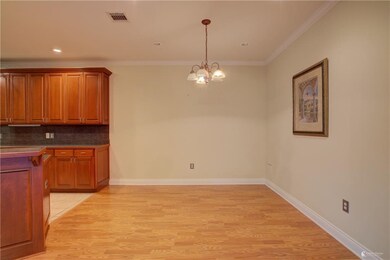 BREAKFAST AREA Leading into Kitchen. PHOTO BY Ashl