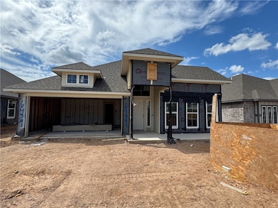 Unfinished property featuring roof with shingles and a balcony