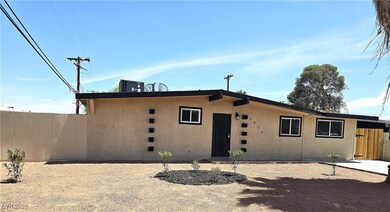 Back of property featuring fence, cooling unit, an