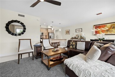 Living room featuring sink and ceiling fan