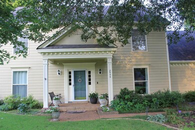 View of front of home with a shingled roof