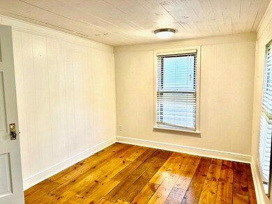 Empty room featuring hardwood / wood-style floors